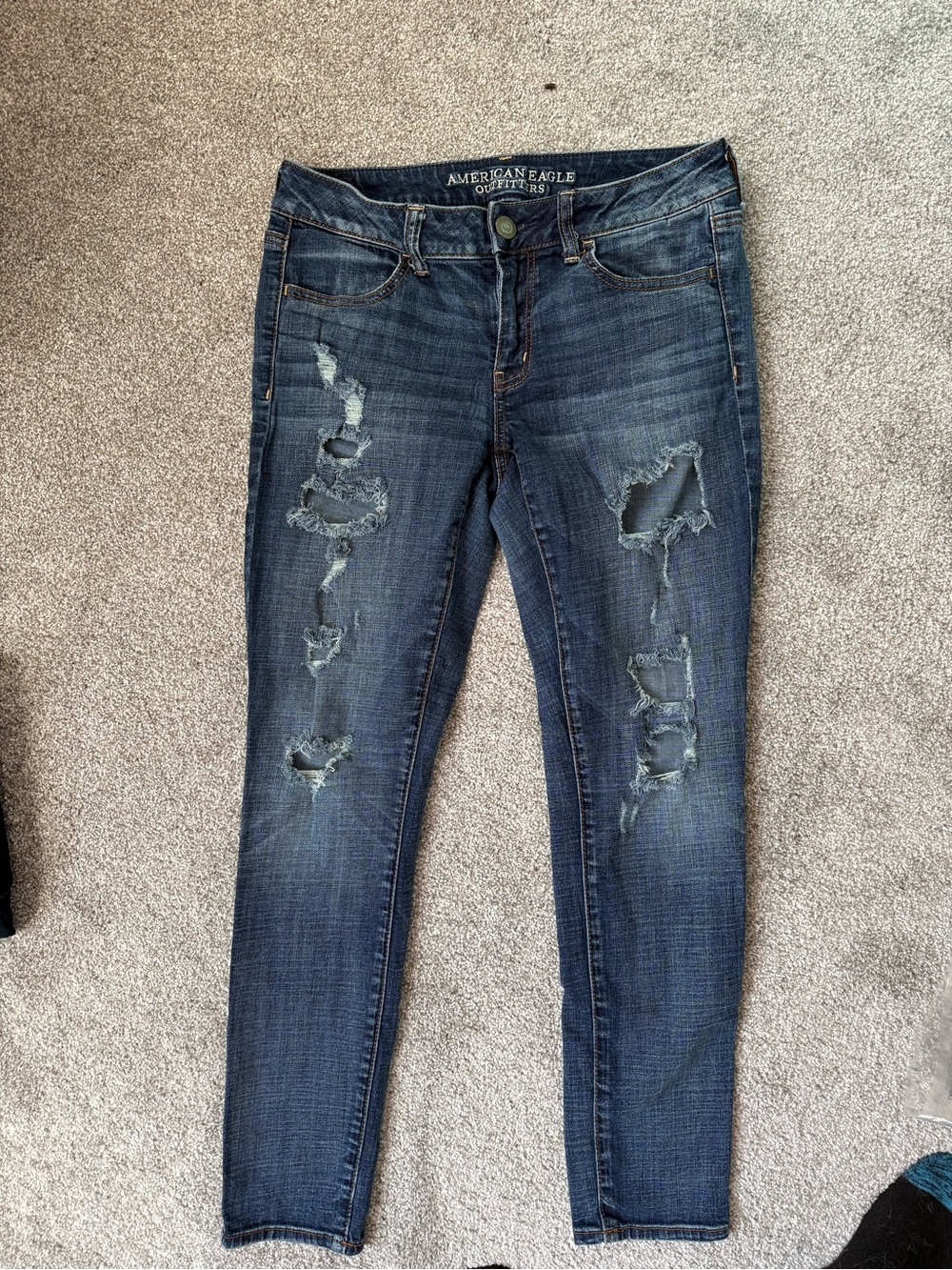 American Eagle Outfitters dark blue ripped jeggings